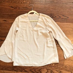 Light pink blouse with bell sleeves